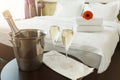 Two glasses and bottle of champagne in hotel Royalty Free Stock Photo