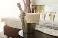 Two glasses and bottle of champagne in hotel Royalty Free Stock Photo