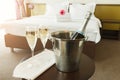 Two glasses and bottle of champagne in hotel Royalty Free Stock Photo