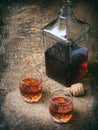 Two glasses of brandy or cognac and bottle Royalty Free Stock Photo