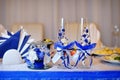 Two glasses and candle on served celebratory table Royalty Free Stock Photo