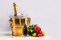 Two glasses of champagne, a bucket with a bottle of champagne and ice Royalty Free Stock Photo