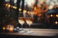 Two glasses of champagne, candles, a Christmas tree against a background of festive golden bokeh. Celebrating New Year, Christmas Royalty Free Stock Photo