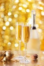 Two glasses of champagne with a Christmas decor in the background. very shallow depth of field, focus on near glass Royalty Free Stock Photo