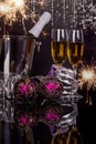 Two glasses with champagne, Christmas ornaments and sparklers Royalty Free Stock Photo