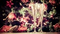 Two glasses of champagne with Christmas tree background and spar Royalty Free Stock Photo