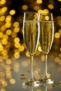 Two glasses of champagne on festive lights bokeh Royalty Free Stock Photo