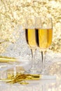 Two glasses champagne with gift and horns Royalty Free Stock Photo