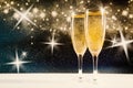 Two glasses of champagne with golden confetti, glitter, serpentine and lights. Night of celebration concept Royalty Free Stock Photo