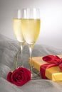 Two Glasses of Champagne with One Single Red Rose and Box of Gourmet Chocolates #1 Royalty Free Stock Photo