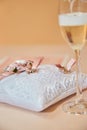 Two glasses of a champagne and pillow with wedding rings. Royalty Free Stock Photo