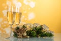 Two glasses with champagne, pine branch decorated with ribbon, N Royalty Free Stock Photo