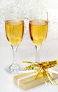 Two glasses of champagne with present and horn Royalty Free Stock Photo