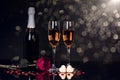 Two glasses of champagne, red rose and two heart shape chocolates Royalty Free Stock Photo