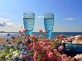 Beautiful nature vacation  romantic  summer  at sunset seascape two blue glasses of Champagne  living  coral blue white color wild Royalty Free Stock Photo