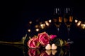 Two glasses of champagne, roses and heart shape chocolate