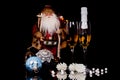 Two glasses with champagne, Santa Claus and Christmas decoration Royalty Free Stock Photo