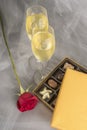 Two Glasses of Champagne, Single Red Rose and an Open Box of Gourmet Chocolates #3 Royalty Free Stock Photo