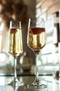 two glasses with champagne and strawberries. light and shadow, silhouette. romantic evening Royalty Free Stock Photo