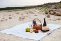 Two glasses of champagne. Picnic on the beach at sunset in the w