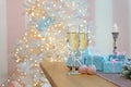 Two glasses of champagne surrounded by luxury Christmas New year background and decoration, light bokeh effect Royalty Free Stock Photo