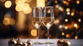 Two glasses of champagne toasting in the nigh with lights bokeh, glitter and sparks on the background Royalty Free Stock Photo