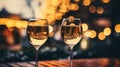 Two glasses of champagne toasting in the nigh with lights bokeh, glitter and sparks on the background Royalty Free Stock Photo