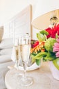 Two glasses of champagne in the upscale hotel room. Dating, romance, honeymoon, valentine, getaway concepts Royalty Free Stock Photo