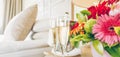 Two glasses of champagne in the upscale hotel room. Dating, romance, honeymoon, valentine, getaway concepts Royalty Free Stock Photo