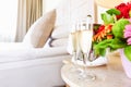 Two glasses of champagne in the upscale hotel room. Dating, romance, honeymoon, valentine, getaway concepts Royalty Free Stock Photo