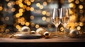 Two glasses of champagne on the wooden table with party ornament and balloons in gold color, with beautiful light bokeh, Christmas Royalty Free Stock Photo