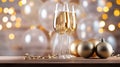 Two glasses of champagne on the wooden table with party ornament and balloons in white and gold colors, with beautiful light bokeh Royalty Free Stock Photo