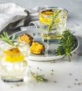 Two glasses of Charred Lemon, Rosemary and Coriander Gin and Tonic is a flavors are perfectly balanced refreshing cocktail. on Royalty Free Stock Photo