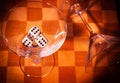 Two glasses on a chessboard Royalty Free Stock Photo