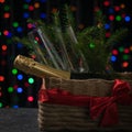 Two glasses with Christmas balloons and ribbons on a background of colored bokeh. Royalty Free Stock Photo