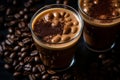 two glasses of coffee with coffee beans around them Royalty Free Stock Photo