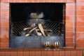 Two glasses of cognac on the old brick fireplace Royalty Free Stock Photo