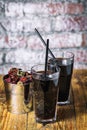 Two glasses of cola and bucket of chicken fryed wings