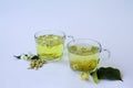 Two glasses cups with herbal hot jasmine tea and Tea from Linden flowers Royalty Free Stock Photo