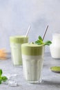 Two glasses of Dalgona Matcha latte tea. Close up. Vertical format Royalty Free Stock Photo