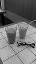 two glasses of drink in an aesthetic coffee shop