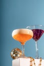 Two glasses of festive champagne and cotton candy cocktails on blue background. Christmas or new year celebration Royalty Free Stock Photo