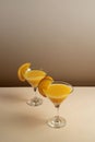 two glasses filled with orange juice and sliced oranges on a table Royalty Free Stock Photo
