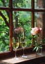 Elegant Peonies and Sparkling Wine Glasses by a Sunny Window Sill