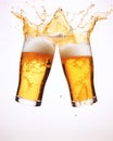 Two glasses of fresh beer bumping on white background