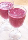 Two glasses of fresh berry smoothies