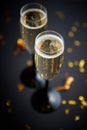 Two glasses full of sparkling champagne wine with golden decoration Royalty Free Stock Photo