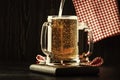 Two glasses of german light beer, beer poured into mug, dark bar Royalty Free Stock Photo