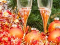 Two glasses with gold Xmas decorations and tree 2 Royalty Free Stock Photo