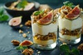 Two glasses of Greek yogurt with honey, figs and walnuts